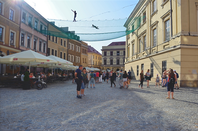 26 - The Urban Highline Festival in Lublin, Poland, showcasing highliners walking on slacklines rigged between historic buildings